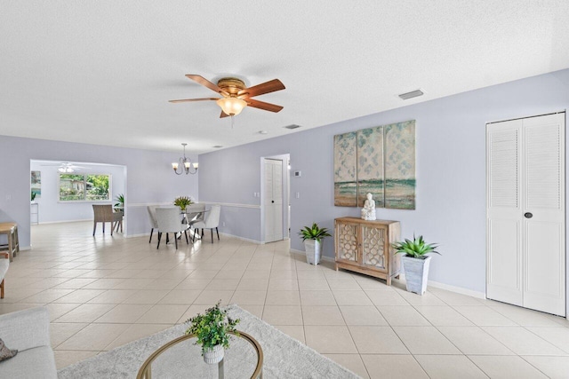3187 Buccaneer Rd, Lake Worth, FL 33462 - living area with ceiling fan, a chandelier, a textured ceiling, baseboards, and light tile patterned floors
