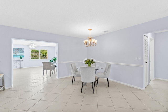 3187 Buccaneer Rd, Lake Worth, FL 33462 - dining room featuring a chandelier, baseboards, light tile patterned floors, and ceiling fan