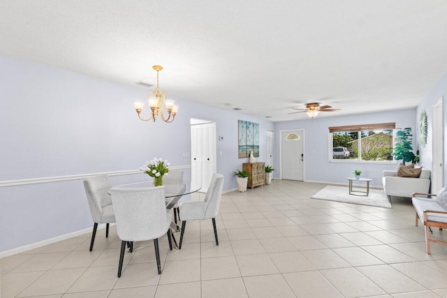 3187 Buccaneer Rd, Lake Worth, FL 33462 - dining area featuring a chandelier, ceiling fan, baseboards, and light tile patterned floors