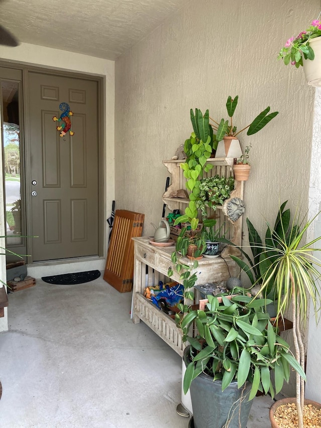 1428 W Wickham C Cir Unit C, Delray Beach, FL 33445 - doorway to property featuring stucco siding