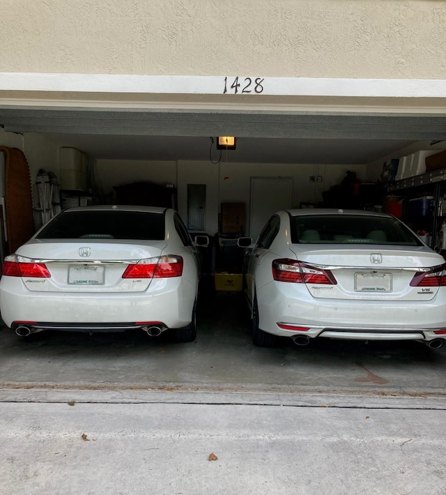 1428 W Wickham C Cir Unit C, Delray Beach, FL 33445 - garage with electric panel and a garage door opener
