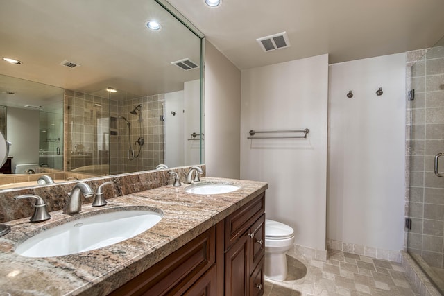 4200 N Ocean Dr Unit 1-1405, Singer Island, FL 33404 - bathroom with a shower stall, double vanity, toilet, and recessed lighting