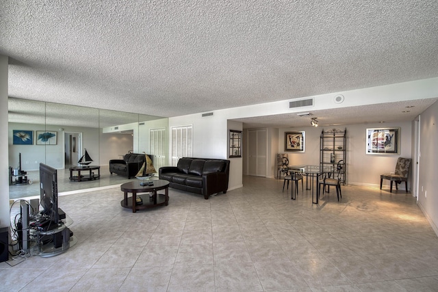 4200 N Ocean Dr Unit 1-1405, Singer Island, FL 33404 - living area with a textured ceiling and light tile patterned floors