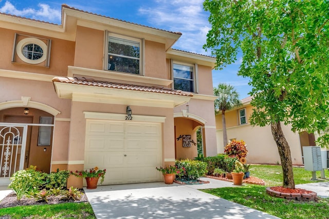 212 River Bluff Ln, Royal Palm Beach, FL 33411 - mediterranean / spanish-style house with stucco siding, driveway, a garage, and a tile roof
