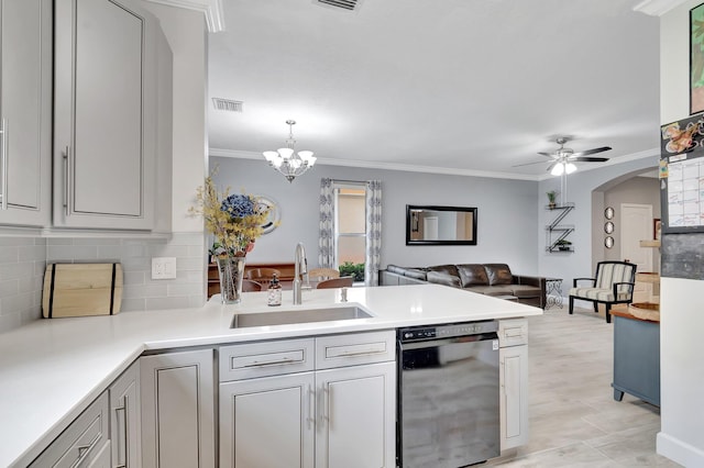 212 River Bluff Ln, Royal Palm Beach, FL 33411 - kitchen featuring black dishwasher, a sink, a peninsula, backsplash, and light countertops