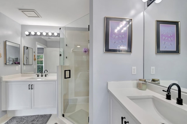 212 River Bluff Ln, Royal Palm Beach, FL 33411 - bathroom featuring a shower stall and two vanities