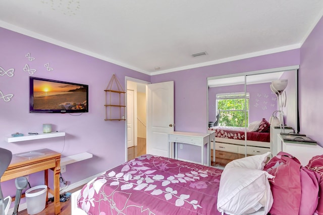 212 River Bluff Ln, Royal Palm Beach, FL 33411 - bedroom with a closet, wood finished floors, and baseboards
