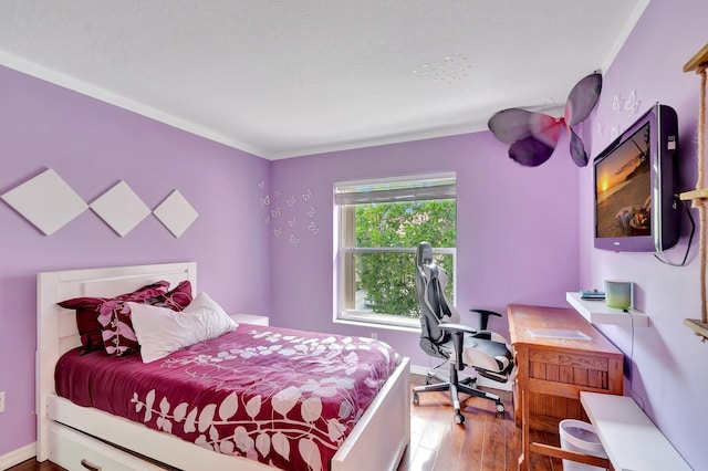 212 River Bluff Ln, Royal Palm Beach, FL 33411 - bedroom with wood finished floors, a desk, and baseboards