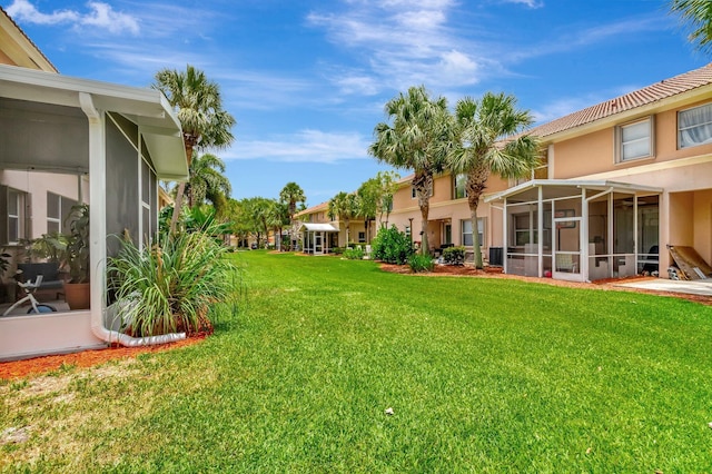 212 River Bluff Ln, Royal Palm Beach, FL 33411 - view of green lawn featuring a sunroom