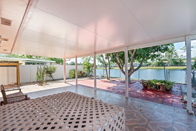5082 Grant Ln, West Palm Beach, FL 33415 - fenced backyard with a patio area, a water view, and a gate