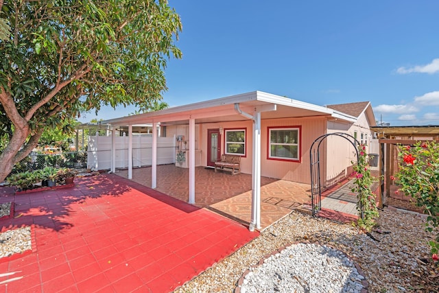 5082 Grant Ln, West Palm Beach, FL 33415 - view of front facade with a patio area