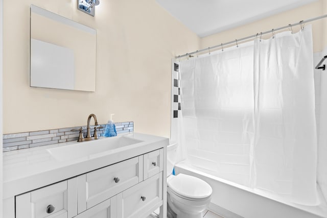 5082 Grant Ln, West Palm Beach, FL 33415 - full bathroom with vanity, toilet, and shower / bath combination with curtain