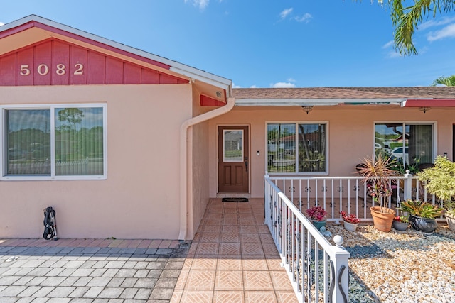 5082 Grant Ln, West Palm Beach, FL 33415 - doorway to property featuring stucco siding