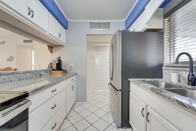 12027 Greenway Cir S Unit 204, Royal Palm Beach, FL 33411 - kitchen with a sink, light tile patterned floors, white cabinets, ornamental molding, and stainless steel appliances