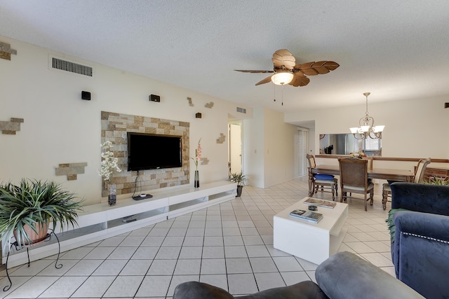 12027 Greenway Cir S Unit 204, Royal Palm Beach, FL 33411 - living area featuring a chandelier, a ceiling fan, a textured ceiling, and light tile patterned flooring