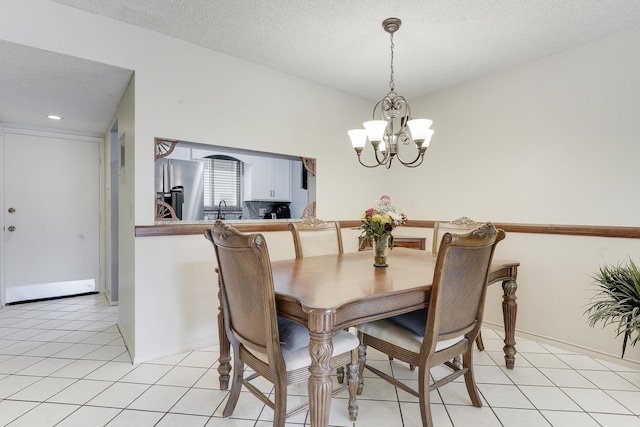12027 Greenway Cir S Unit 204, Royal Palm Beach, FL 33411 - dining room with a chandelier, a textured ceiling, and recessed lighting