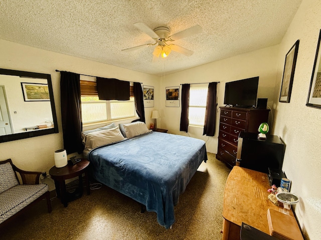 3901 Neptune Dr SE, Saint Petersburg, FL 33705 - bedroom with a textured ceiling, ceiling fan, and a textured wall