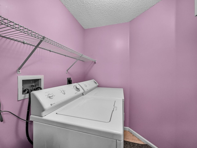 6287 Grand Cypress Cir, Lake Worth, FL 33463 - laundry room with washer and dryer, a textured ceiling, and baseboards