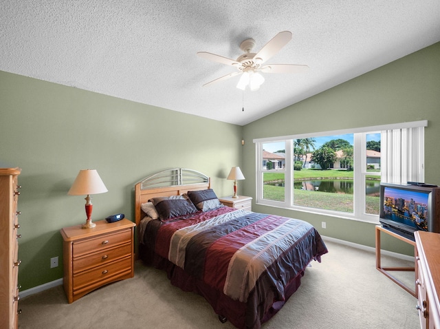 6287 Grand Cypress Cir, Lake Worth, FL 33463 - bedroom with carpet floors, vaulted ceiling, a textured ceiling, baseboards, and a ceiling fan