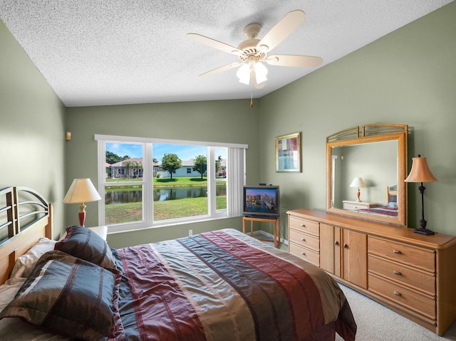 6287 Grand Cypress Cir, Lake Worth, FL 33463 - carpeted bedroom with vaulted ceiling, a textured ceiling, and a ceiling fan