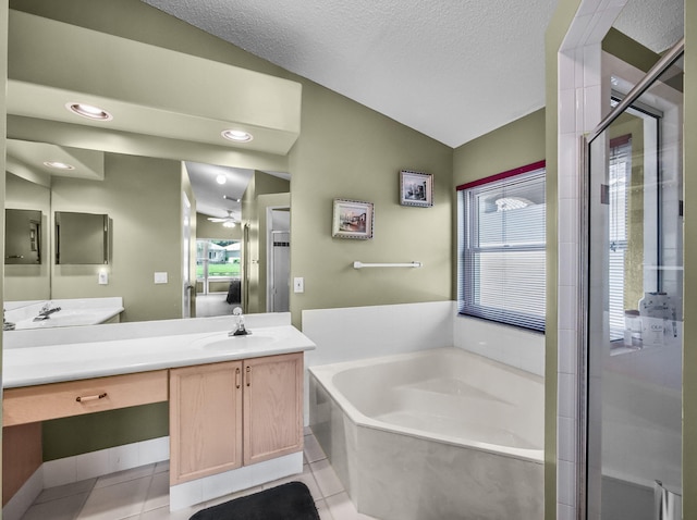 6287 Grand Cypress Cir, Lake Worth, FL 33463 - bathroom with lofted ceiling, a bath, healthy amount of natural light, vanity, and tile patterned flooring