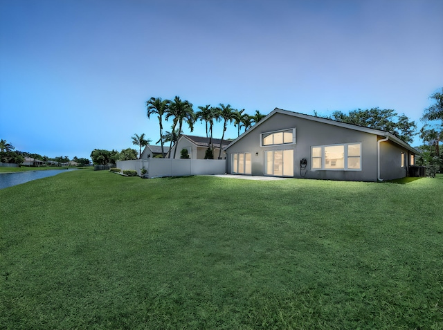 6287 Grand Cypress Cir, Lake Worth, FL 33463 - view of front of home featuring a water view, stucco siding, and cooling unit