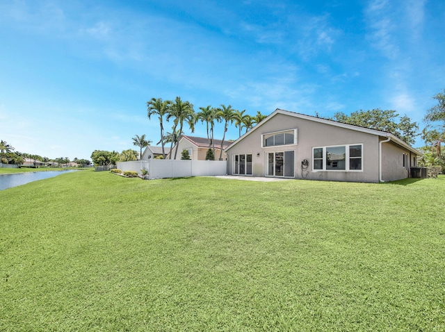 6287 Grand Cypress Cir, Lake Worth, FL 33463 - rear view of house featuring a water view, central AC unit, and stucco siding