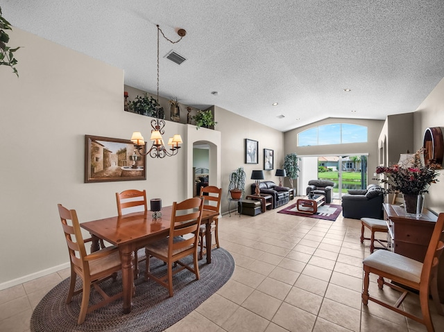 6287 Grand Cypress Cir, Lake Worth, FL 33463 - dining area with light tile patterned floors, vaulted ceiling, a chandelier, and a textured ceiling