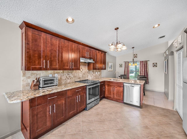 6287 Grand Cypress Cir, Lake Worth, FL 33463 - kitchen featuring appliances with stainless steel finishes, under cabinet range hood, a sink, a peninsula, and decorative backsplash