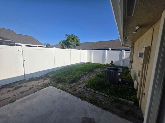 4580 Discovery Ln Unit 23, West Palm Beach, FL 33417 - fenced backyard with a patio and central AC unit