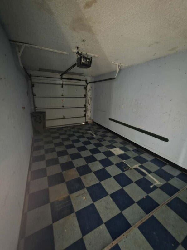 4580 Discovery Ln Unit 23, West Palm Beach, FL 33417 - garage with a garage door opener