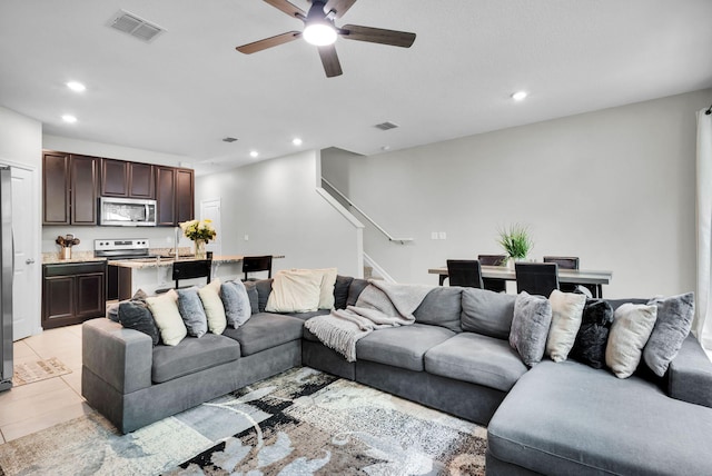 6340 Sailpointe Ln, West Palm Beach, FL 33413 - living room with stairs, a ceiling fan, recessed lighting, and light tile patterned floors