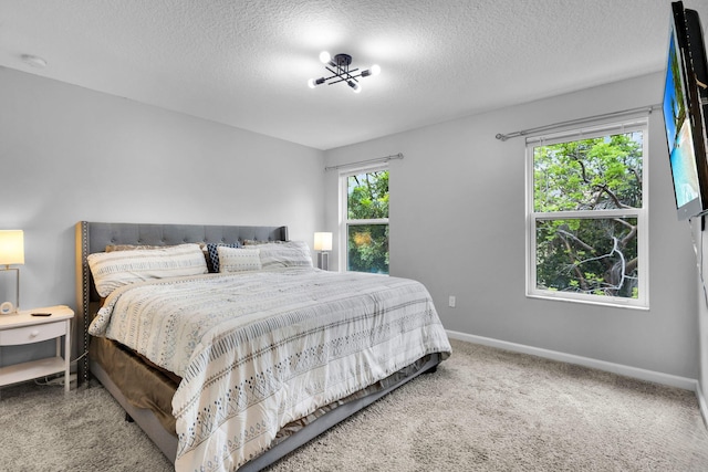 6340 Sailpointe Ln, West Palm Beach, FL 33413 - carpeted bedroom with baseboards and a textured ceiling