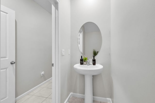 6340 Sailpointe Ln, West Palm Beach, FL 33413 - bathroom featuring tile patterned floors, baseboards, and a sink