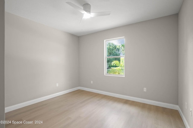 181 Ferguson St SE, Palm Bay, FL 32909 - unfurnished room with light wood finished floors, a ceiling fan, and baseboards