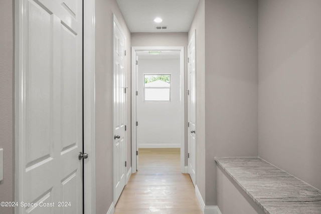 181 Ferguson St SE, Palm Bay, FL 32909 - hall with light wood-style flooring, baseboards, and recessed lighting