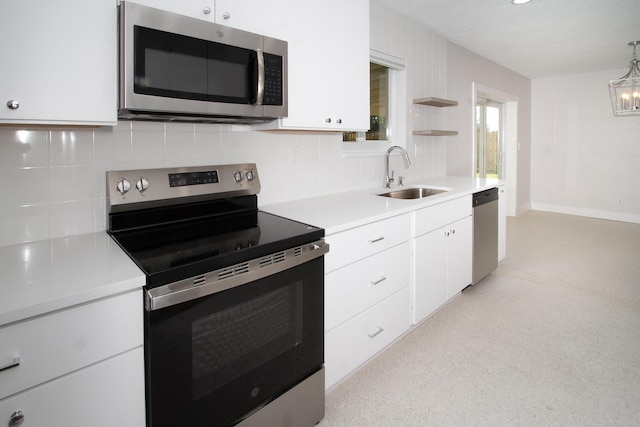 214 SW 3rd St, Boca Raton, FL 33432 - kitchen with appliances with stainless steel finishes, a sink, light countertops, decorative backsplash, and open shelves