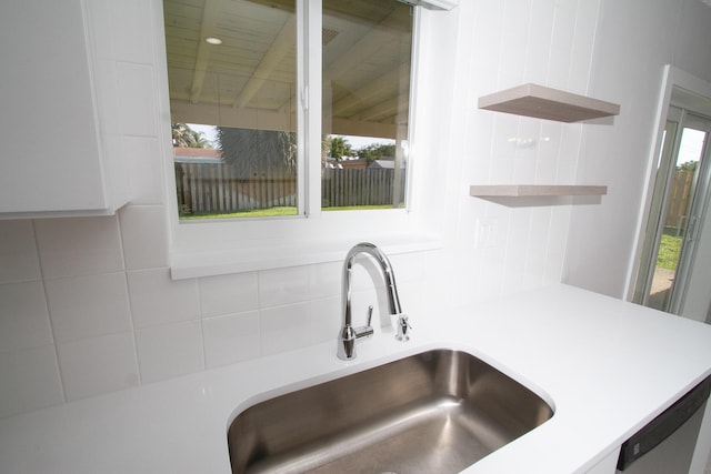214 SW 3rd St, Boca Raton, FL 33432 - kitchen view of a sink, open shelves, backsplash, and light countertops