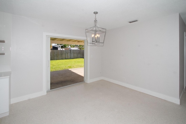 214 SW 3rd St, Boca Raton, FL 33432 - unfurnished dining area featuring a chandelier, baseboards, and speckled floor