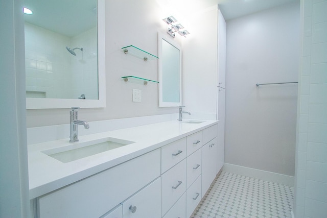 214 SW 3rd St, Boca Raton, FL 33432 - bathroom with double vanity, baseboards, and tile patterned floors