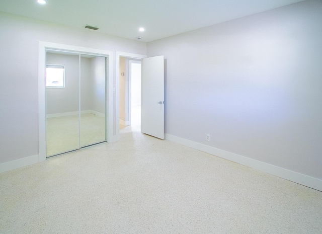 214 SW 3rd St, Boca Raton, FL 33432 - unfurnished bedroom with recessed lighting, a closet, baseboards, and speckled floor