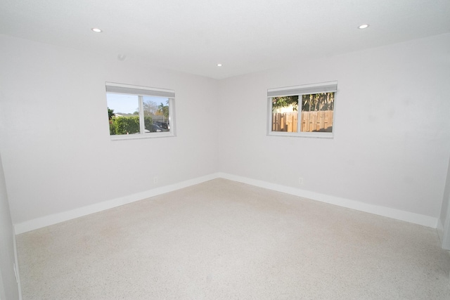 214 SW 3rd St, Boca Raton, FL 33432 - spare room with plenty of natural light, recessed lighting, baseboards, and speckled floor
