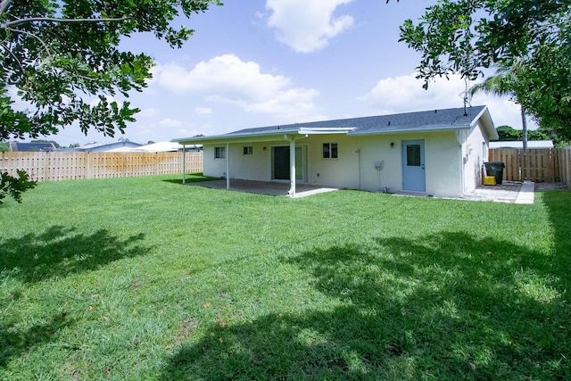 214 SW 3rd St, Boca Raton, FL 33432 - back of property featuring a patio area and stucco siding