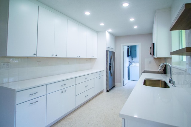 214 SW 3rd St, Boca Raton, FL 33432 - kitchen with a sink, stainless steel appliances, recessed lighting, decorative backsplash, and light countertops