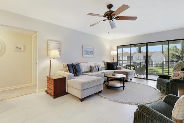 755 Saturn St Unit E 202, Jupiter, FL 33477 - living room featuring a ceiling fan and baseboards