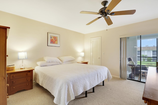 755 Saturn St Unit E 202, Jupiter, FL 33477 - carpeted bedroom featuring access to outside, baseboards, and a ceiling fan