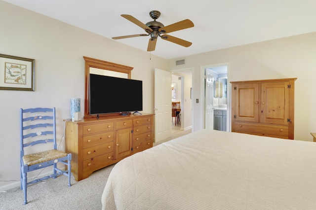 755 Saturn St Unit E 202, Jupiter, FL 33477 - bedroom with light colored carpet, ceiling fan, and connected bathroom