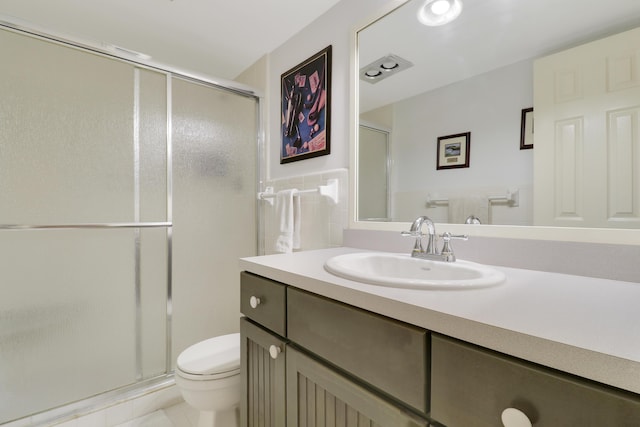 755 Saturn St Unit E 202, Jupiter, FL 33477 - bathroom featuring toilet, a shower stall, vanity, and tile patterned floors