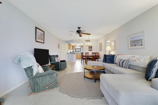 755 Saturn St Unit E 202, Jupiter, FL 33477 - living room featuring light tile patterned floors, a ceiling fan, a chandelier, and baseboards