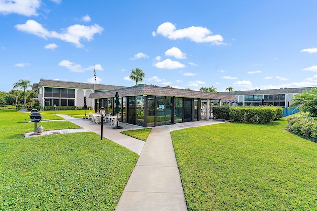 755 Saturn St Unit E 202, Jupiter, FL 33477 - view of community with a lawn